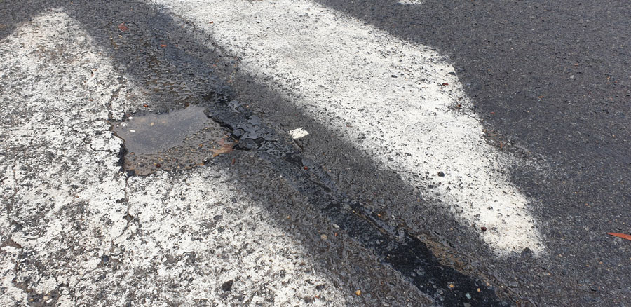 How to fix potholes and cracks in asphalt